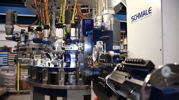 Rotary transfer machine with press